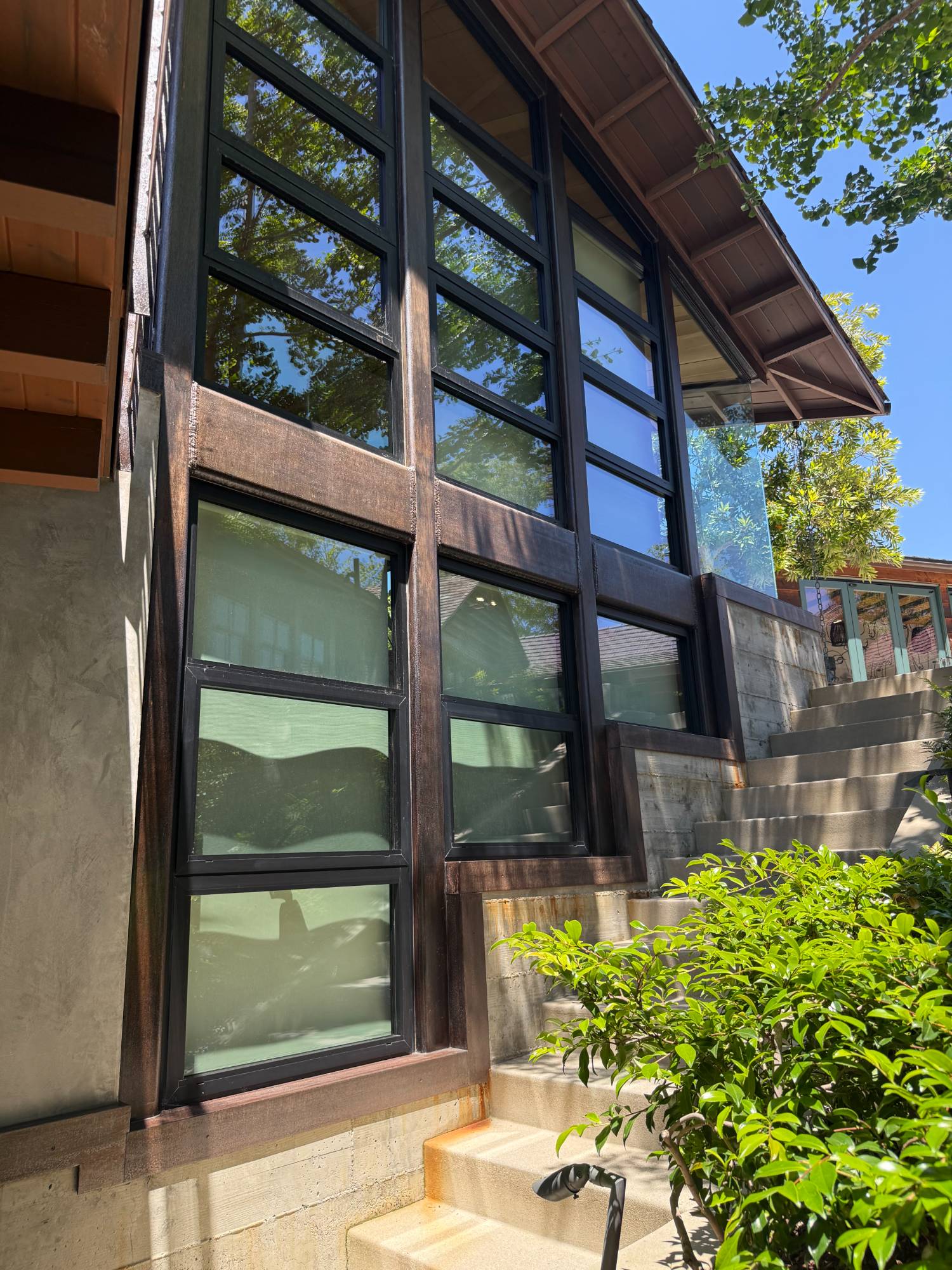 Detail of the hand-built steel-square window frames with custom on-site finish. Brentwood residence by ESRL Development.
